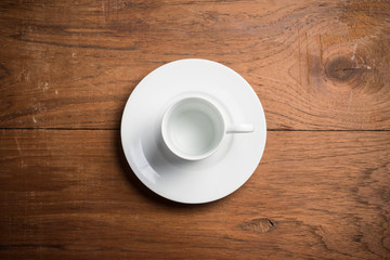 Empty coffee cup on the wood table