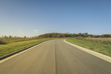 Asphalt road in new real estate subdivision