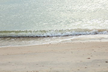 Sand beach with wave of the sea.