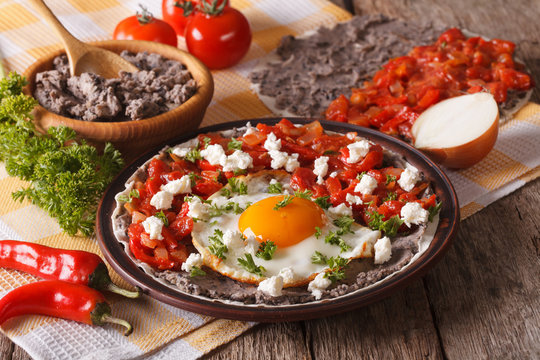 Mexican breakfast: huevos rancheros close-up. Horizontal
