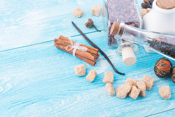 dry tea leaves cinnamon and on wooden background