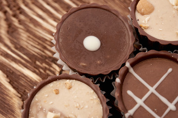 Dark chocolate on wooden background