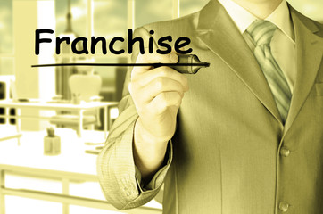 business man writing franchise