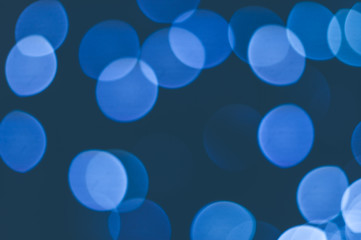Abstract background of blue blurred lights with bokeh effect