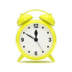 Yellow alarm clock on white