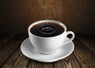Cup of coffee on wooden background.