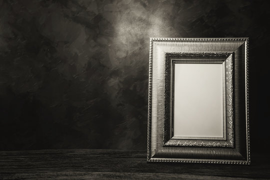 Still Life Of Picture Frame On Table