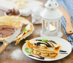 Christmas breakfast. Crepes with chocolate cream.