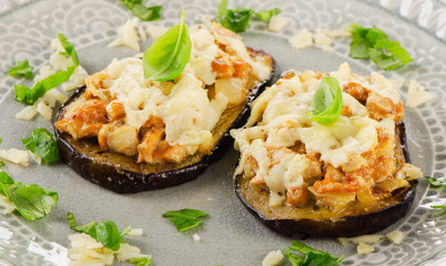 Baked eggplant with chanterelles, cheese and fresh basil.
