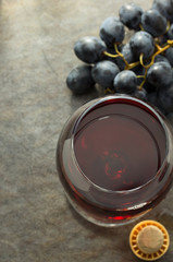 cognac glass and grapes