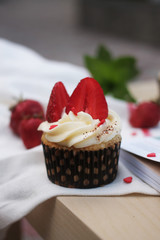 Tasty cupcake with strawberry