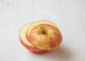 Naklejka na ściany i meble apple slices on white wooden background