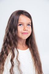 Portrait of a beautiful little girl looking up