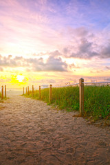 Path on the sand going to the ocean in Miami Beach Florida at sunrise or sunset, beautiful nature landscape, retro instagram filter for vintage looks