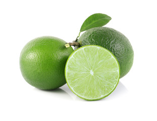 Fresh limes with green leaf. Isolated on white