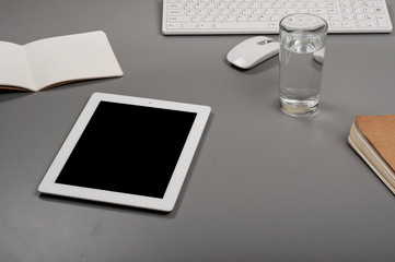 White tablet with a glass of water