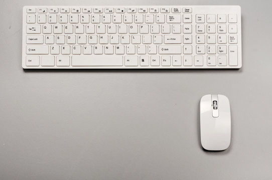White slim keyboard with a white slim mouse