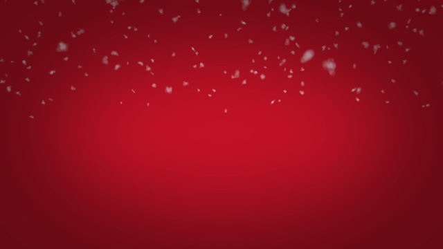 Realistic snow falling in front of christmas styled red background