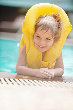 Little Girl In Inflatable Waistcoat