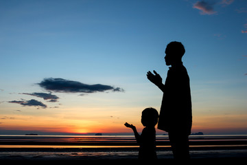 Father and son praying