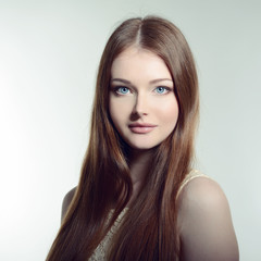 Naklejka premium Pretty woman. Portrait of young attractive woman. Image toned.
