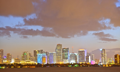 Miami Florida skyline of downtown colorful buildings lights and beautiful sunset