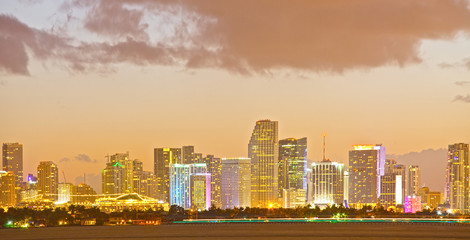 Miami Florida skyline of downtown colorful buildings lights and beautiful sunset