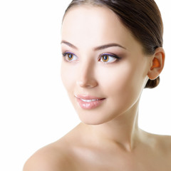 Obraz premium Portrait of young attractive woman smiling and looking at camera