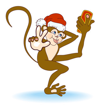 Dancing Monkey in Santa Hat taking selfie photo on smart phone and make a hand gesture Peace. Monkey taking self-portrait and play the ape, showing tongue at camera.