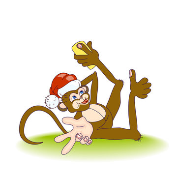 Lying Monkey in Santa Hat taking selfie photo on smart phone and make a hand gesture Peace and Thumb up. Monkey taking self-portrait and play the ape, showing tongue at camera.