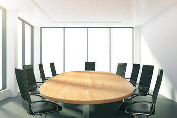 Light conference room with oval wooden table