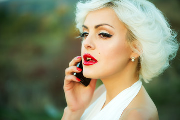 Sexy blonde with phone