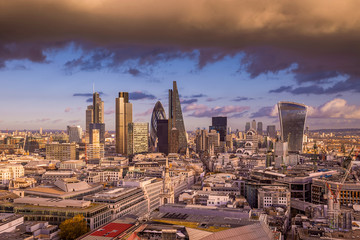 Fototapeta premium Dramatic clouds at sunset over London's business district - Panoramic skyline of London - UK