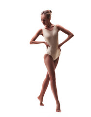 young beautiful dancer in beige swimsuit 