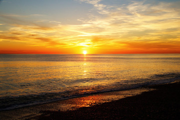Sun rising over the sea Brighton, England, UK,