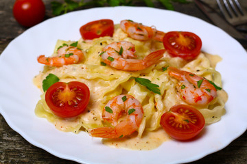 pasta with shrimp, tomatoes, herbs and cream sauce