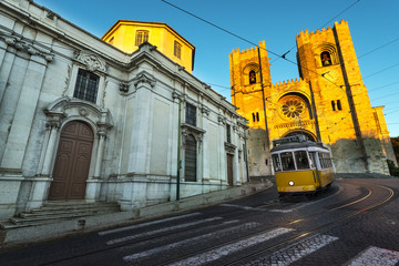 Tram in front of the Lisbon Cathedral at sunset