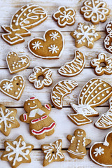 Christmas homemade gingerbread cookies on white wooden table 
