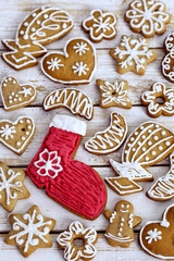 Christmas homemade gingerbread cookies on white wooden table 