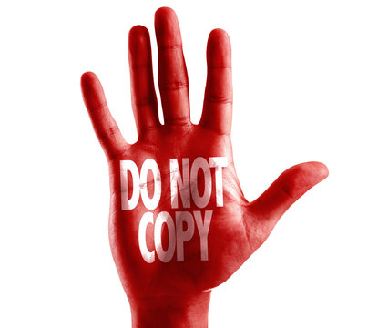 Do Not Copy written on hand isolated on white background