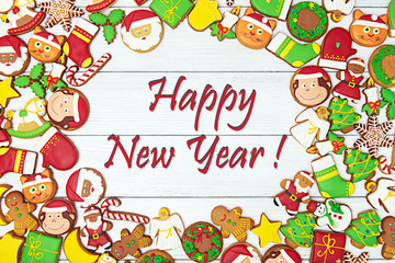 Fototapeta premium Happy New Year card. With variety of gingerbread cookies