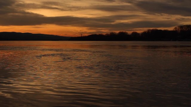 Sunset over Danube river; handheld footage; no people; beautiful colors; 