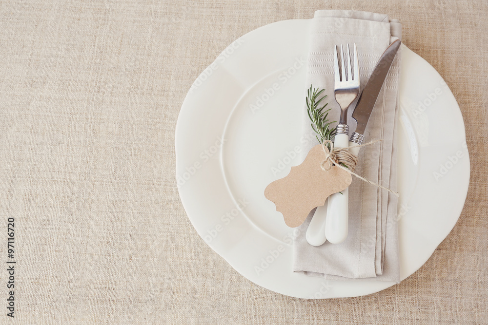 Wall mural table place setting with rosemary and empty tag, copy space background