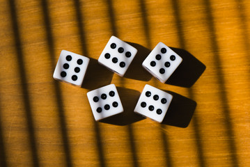 White dice on wooden table