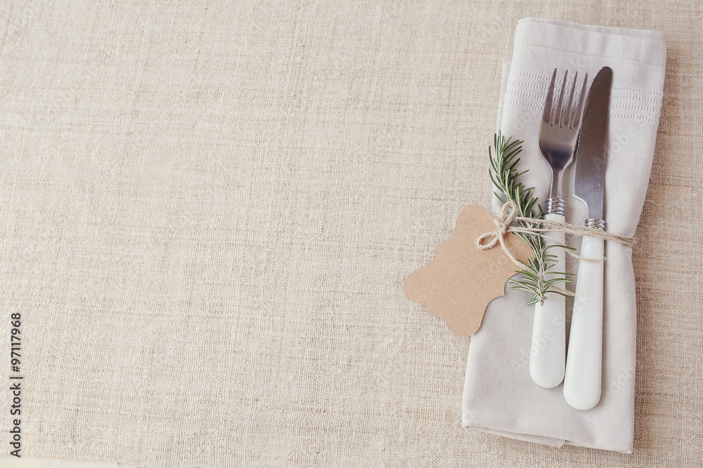 Wall mural table place setting with rosemary and empty tag, copy space background