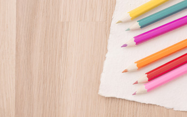 Fototapeta na wymiar Colored pencils and drawing paper