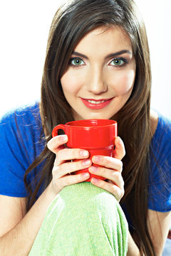 Smiling woman hold red coffee cup.
