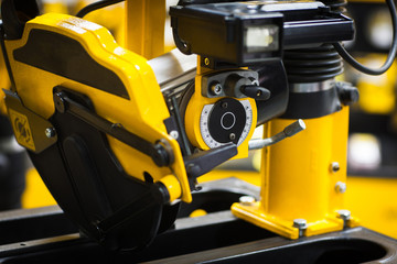 Industrial circular saw. Black workshop background