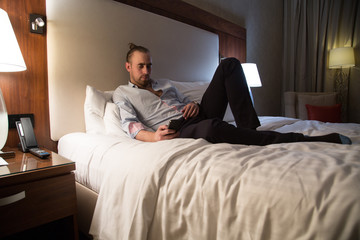 Fototapeta premium Man on the bed