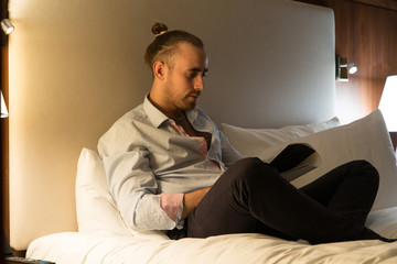 Fototapeta premium Man on the bed